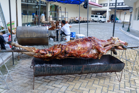 Manila, Philippines - Jul 14, 2018 : Cow being roasted in burning charcoal at Manila Restaurantのeditorial素材