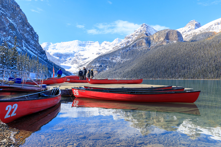 Alberta, Canada - October 7, 2018 : Red canoes at Lake Louise with rocky mountain in Banff national parkのeditorial素材