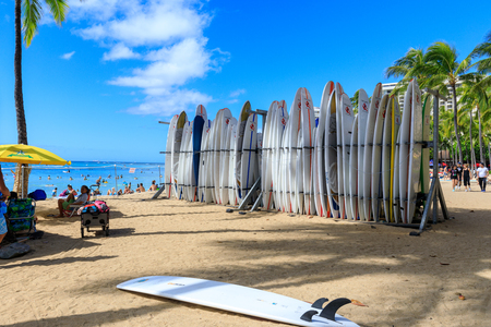 Honolulu, Hawaii - Dec 23, 2018 : Surfboards lined up in the rack at famous Waikiki Beach in Honolulu. Oahuのeditorial素材
