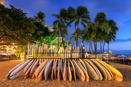 Honolulu, Hawaii - Dec 23, 2018 : Surfboards stack on the landmark Waikiki Beach at sunsetのeditorial素材