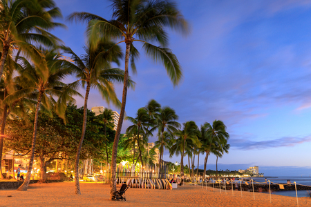 Honolulu, Hawaii - Dec 23, 2018 : Surfboards stack on the landmark Waikiki Beach at sunsetのeditorial素材