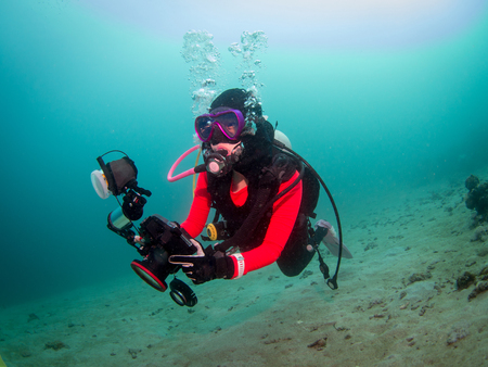 Anilao, Philippines - Jul 22, 2017 : Scuba diver doing underwater photography in Anilao Philippinesのeditorial素材