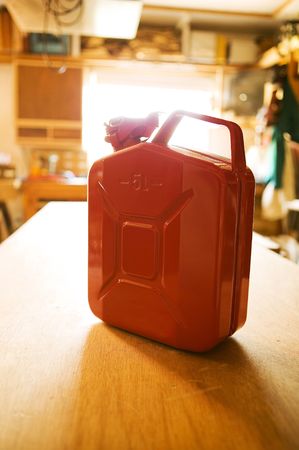 Safety style cascan sitting on a workbench.の写真素材