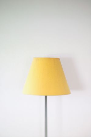 A room lamp next to the wall with shallow focus applied.の写真素材