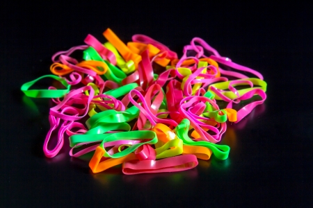 Multicolored rubber isolated on black backgroundの写真素材
