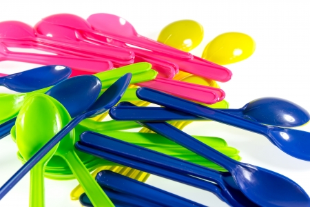 Multicolored plastic spoon isolated on white backgroundの写真素材