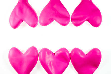 Pink heart balloons isolated on white の写真素材