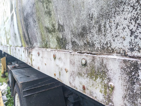 abandoned old truck in a scrapyard, closeup of photo