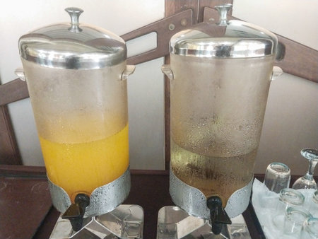 Boiling water in a glass pot on a shelf in a restaurantのeditorial素材