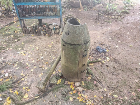 Old rusty water pump on the ground in the garden, Biak Island, Papua.のeditorial素材