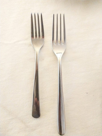 Fork and knife on a linen tablecloth, close-up