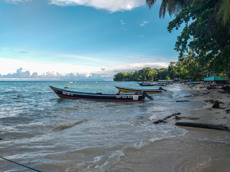 Fishing boats on the beach of the island of  Biak, Papua, Indonesia.のeditorial素材