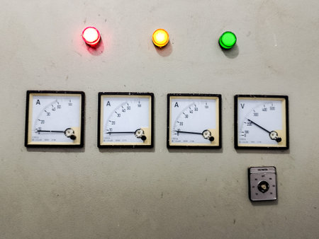 Control panel of a power plant with multi-colored lamps and switches