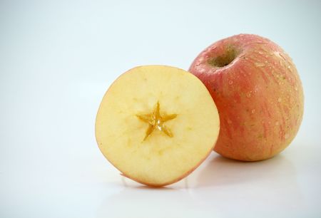 star from piece of apple on backgroundの写真素材