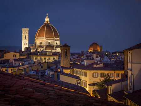 The Cattedrale di Santa Maria del Fiore - night view at cathedral dome and bell tower. Clear, blue sky and city lights.のeditorial素材