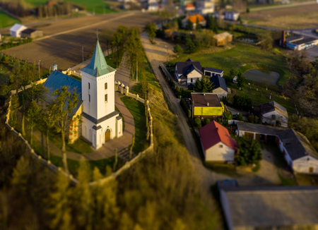 Sunset over lazy village church. Peaceful rural sceneの写真素材