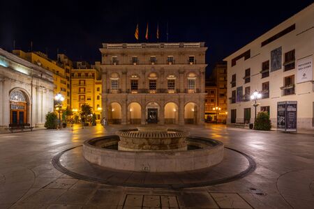 Town Hall in Castellon, Spain in night - 2019.08.10. Building of historic town hall with fountain next to it.のeditorial素材