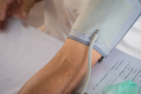 Woman using Pressure Gauge for her pressure test.の写真素材