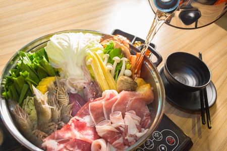 shabu-shabu food on wood backgroundの写真素材