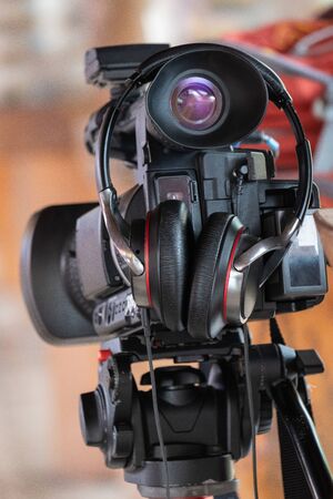 Video camera Stand on the stand with headphones