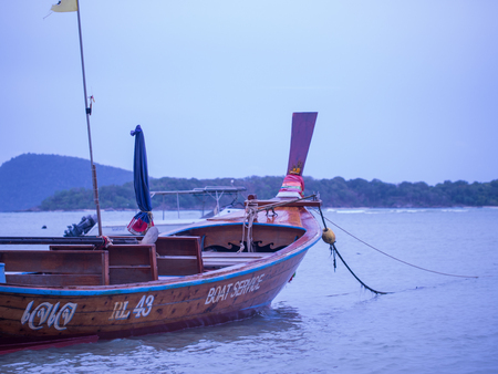 Phuket, Thailand - May 26, 2016 : The wooden boat, classical vintage style, at the port with Thai letter of its name.のeditorial素材
