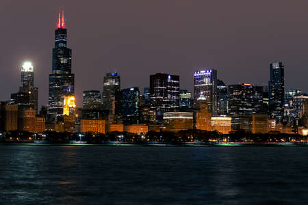 Skyline of Chicago seen at night from across Lake Michiganのeditorial素材