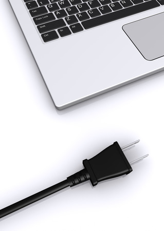 notebook and plug socketの写真素材