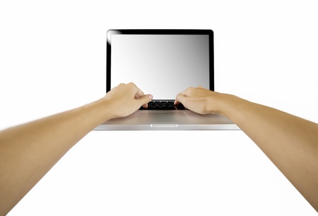 laptop with woman hand isolated on white backgroundの写真素材