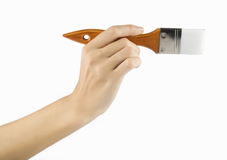 woman paints a picture with a brush の写真素材