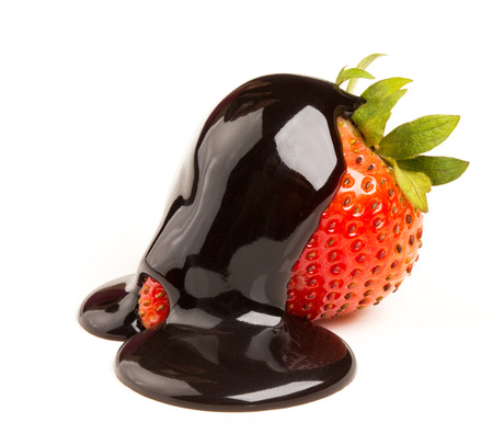 strawberries and chocolate on a white backgroundの写真素材