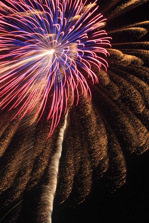 Japanese traditional fireworks against a black sky の写真素材