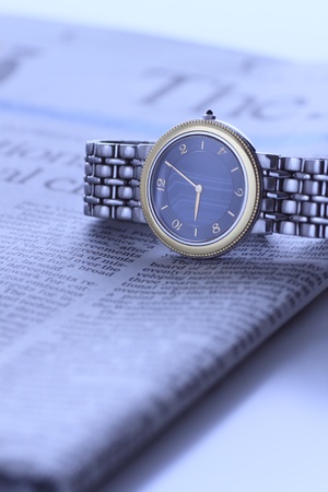 wrist  watch over newspaperの写真素材