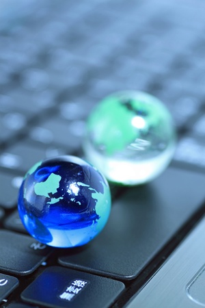 Glass globe over keyboardの写真素材