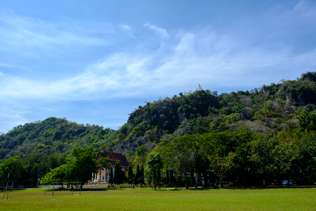 A small temple in the forest under clear blue sky.の写真素材