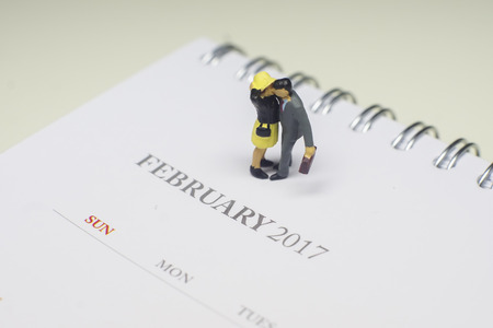 Miniature Couple with Calendar, Image for Love Couple Concept
