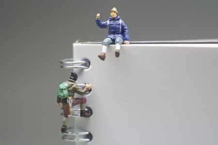 Miniature Figures Hikers with White Background and Space  for Textの写真素材