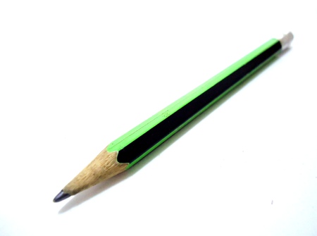 Used wooden pencil on white backgroundの写真素材
