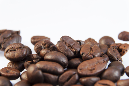 Photo macro coffee beans on a white background.の写真素材