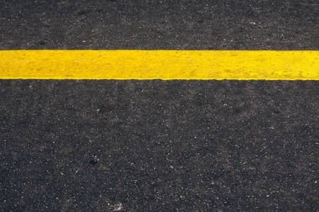 road texture with yellow stripe の写真素材