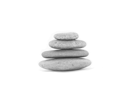 Black and white pile of stones isolated on white background の写真素材