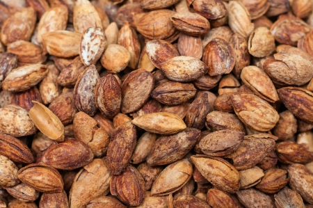 Pile of almonds close-up as background  の写真素材