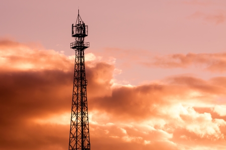 Mobile phone communication repeater antenna tower as Silhouette background の写真素材