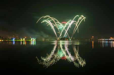 fireworks with reflection in the lakeの写真素材