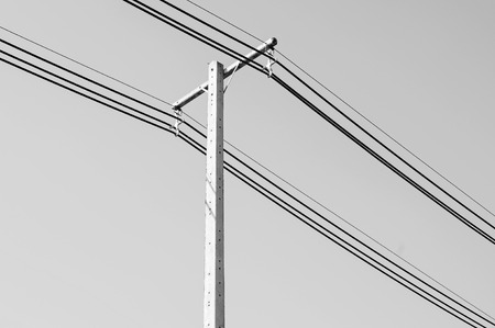 Black and white of electric power post with wire の写真素材