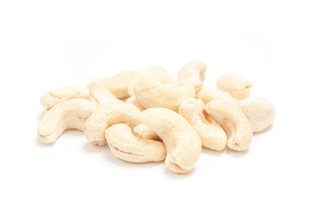 Cashew nuts isolated on white backgroundの写真素材