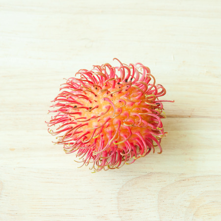 rambutan on wood backgroundの写真素材