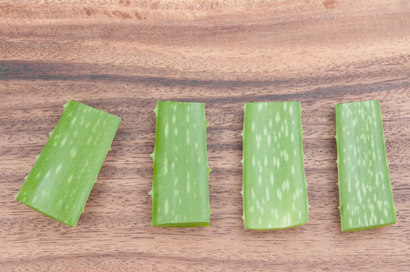 Aloe vera on woodの写真素材