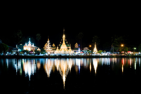 Wat Jong Klang in dark night and reflection at Maehongson, Thailand.の写真素材