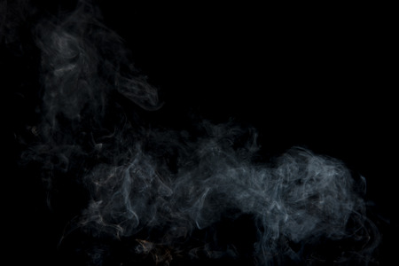 Movement of white smoke on black backgroundの写真素材