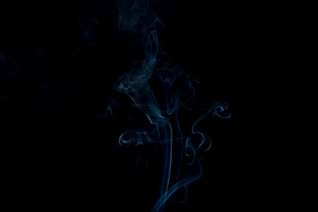 Movement of white smoke on black backgroundの写真素材
